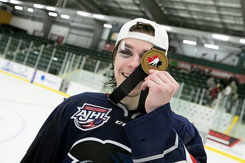 BROOK JONES / WINNIPEG FREE PRESS
The Brooks Bandits (AJHL) defeat the Battlefords North Stars (SJHL) 4-1 to claim the 2023 Centennial Cup at Stride Place in Portage la Prairie, Man., Sunday, May 21, 2023. Pictured: Brooks forward Hunter Wallace, who is from Oak Lake, Man., celebrate the team's Centennial. Cup victory by holding up the championship medal in front of his uninjuried eye during the team's on ice celebration. 