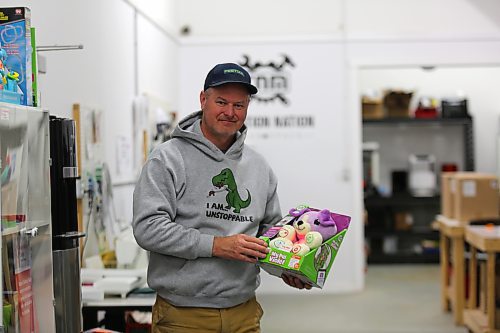 Russ Mitchell, co-ordinator of Creation Nation, a space created for those who make and create, holds up a toy that will be adapted to make it easier for a child with a disability to play with. (Michele McDougall/The Brandon Sun)