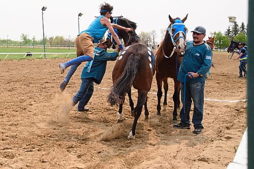 Mike Sudoma/Winnipeg Free Press
Joseph Jackson jumps to get to switch horses at the Indian Horse Relay race held at the Assiniboia Downs Monday afternoon
May 22, 2023
