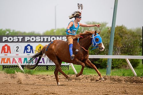 Mike Sudoma/Winnipeg Free Press
Joseph Jackson celebrates as he and his horse In it 2 Win It cross the finish line winning a Warrior Race at the Indian Horse Relay race held at the Assiniboia Downs Monday afternoon
May 22, 2023
