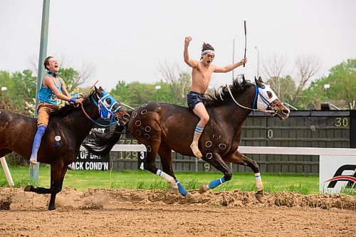 Mike Sudoma/Winnipeg Free Press
Garren Baptiste celebrates after beating out Joseph Jackson during Heat 2 of the Indian Horse Relay race held at the Assiniboia Downs Monday afternoon
May 22, 2023