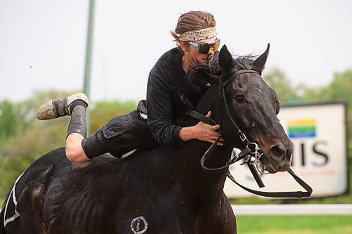 Mike Sudoma/Winnipeg Free Press
Kevin Brown Jr switches horses mid race during the Indian Horse Relay race held at the Assiniboia Downs Monday afternoon
May 22, 2023