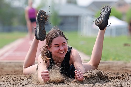 23052023
Mackenzie Lyburn of Vincent Massey High School springs forward into the sand after landing during the varsity girls long jump event at the High School Track and Field City Finals on Tuesday. 
(Tim Smith/The Brandon Sun)