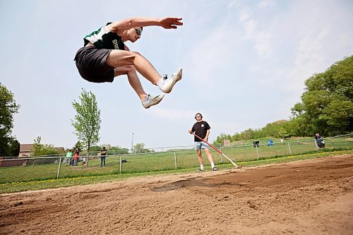 23052023
Sean Taron of &#xc9;cole Secondaire Neelin High School sails through the air while competing in the Junior Varsity long jump event at the High School Track and Field City Finals on Tuesday. 
(Tim Smith/The Brandon Sun)