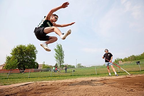 23052023
Sean Taron of &#xc9;cole Secondaire Neelin High School sails through the air while competing in the Junior Varsity long jump event at the High School Track and Field City Finals on Tuesday. 
(Tim Smith/The Brandon Sun)