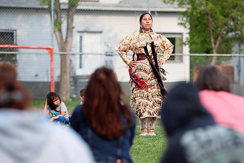 23052023
Jolene Taylor performs a jingle dress dance for visitors to the Light Up Your Dance Pow Wow demonstration at Betty Gibson School in Brandon on Tuesday evening.
(Tim Smith/The Brandon Sun)