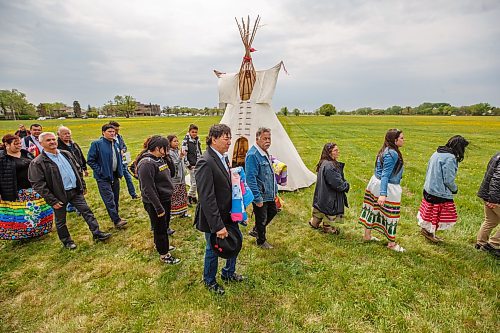 Mike Deal / Winnipeg Free Press
Leaders and dancers end the ceremony with the Retreat of Eagle Staff Flags during the Treaty One Nation Land Reclamation Ceremony for the Naawi-Oodena Treaty One Jointly Held lands, on the former Kapyong Barracks lands in Winnipeg, Wednesday morning.
230524 - Wednesday, May 24, 2023.