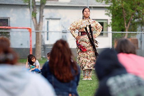 Jolene Taylor performs a jingle dress dance for visitors to the Light Up Your Dance Powwow demonstration at Betty Gibson School in Brandon on Tuesday evening. (Tim Smith/The Brandon Sun)