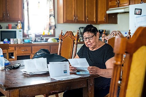 MIKAELA MACKENZIE / WINNIPEG FREE PRESS
 
 Janet Bruyere, grandmother of Fonassa Bruyere (whose body was discovered in a field northwest Winnipeg in 2007), looks at a poem Fonassa wrote on Tuesday, May 23, 2023. For Shelley story.

Winnipeg Free Press 2023.