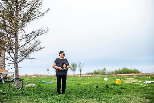 MIKAELA MACKENZIE / WINNIPEG FREE PRESS
 
 Janet Bruyere, grandmother of Fonassa Bruyere (whose body was discovered in a field northwest Winnipeg in 2007), poses for a portrait with a photo of Fonassa oustside of her home on Sagkeeng First Nation on Tuesday, May 23, 2023. For Shelley story.

Winnipeg Free Press 2023.