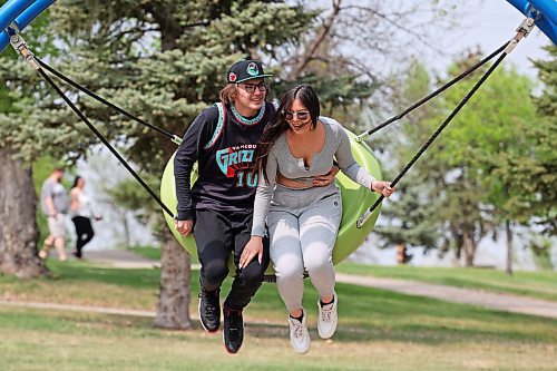 24052023
Kaidence Bone and Sinica Boyer swing together at Rideau Park on a sunny Wednesday afternoon.
(Tim Smith/The Brandon Sun)
