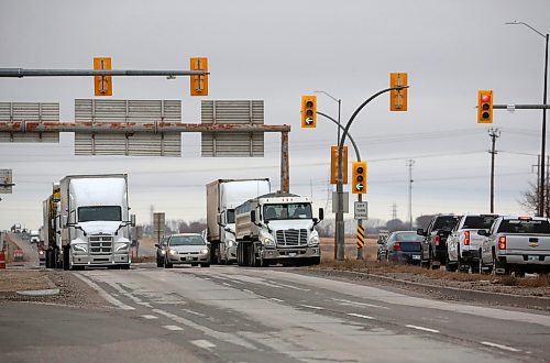 West and eastbound vehicles wait at the First Street traffic lights along the Trans-Canada Highway in Brandon on Monday afternoon. (Matt Goerzen/The Brandon Sun)