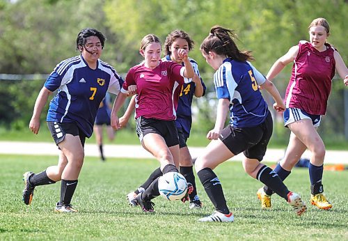 RUTH BONNEVILLE / WINNIPEG FREE PRESS 

Sports - Standup 

St. James Jimmies vs  Westwood Warriors  at    Westwood Collegiate Wednesday. 

Westwood's #5 Kate Krekiewetz works the ball around St. James opponents during season opener at Westwood Collegiate Thursday.  Westwood won 8 -0 against St. James in T2 girls div. 



May 25th, 2023