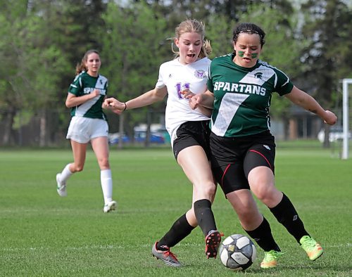 Vikings striker Marayna Kurchaba and Spartans defender Maci Hlady battle for the ball in the Brandon High School Soccer League varsity girls' final on Thursday at Massey. (Thomas Friesen/The Brandon Sun)