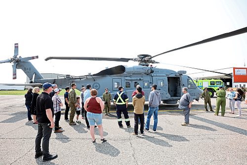 25052023
A Royal Canadian Air Force CH-148 Cyclone landed at Brandon Airport on Thursday as part of an operational cross-country transfer conducted by the 423 Maritime Helicopter Squadron. A few dozen enthusiasts got a chance to get an up close look at the helicopter while it was hosted by the Brandon Flight Centre. 
(Tim Smith/The Brandon Sun)