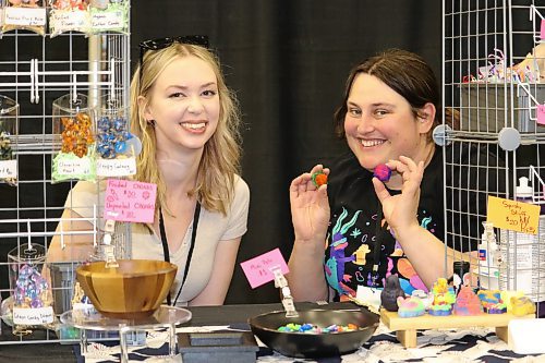 Vendors Paige Bender and Samantha Howell of Karasu Nest showcase their resin dice and other gaming accessories during the opening day of PrairieCon 42. (Kyle Darbyson/The Brandon Sun)