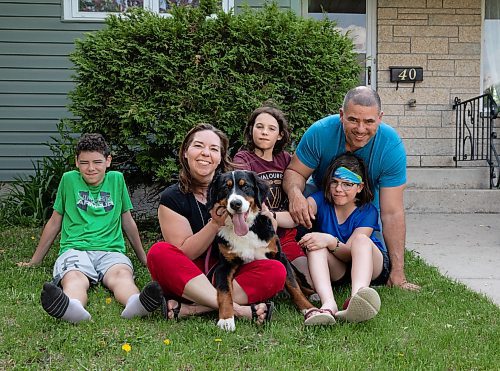 JESSICA LEE / WINNIPEG FREE PRESS

The Melo family, from left to right: Xavier, 13, Sarah, Ramone, 9, Savannah, 11, and Steve, pose at their home with their dog Minnie. Minnie escaped the yard by climbing under a fence, she then boarded a bus. The driver, worried the dog would get hit by a vehicle, asked as each new passenger boarded if they were fine with the dog staying on the bus. After the dog took a trip around the city, the driver took the dog home.

Reporter: Maggie Macintosh