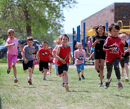 Students at King George School go for a run around the school yard ahead of Sunday's YMCA Strong Kids Run. (Lucas Punkari/The Brandon Sun)