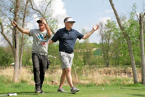 Grady Manson, left, reacts to Dave Scinocca's chip-in birdie to beat Team Crane on the 11th hole of their five-on-five match at Wheat City Golf Course on Friday. The Wheat City staffers won 2 and 1 to avoid paying out $2,500 in club credits for the match, which was an auction prize at the Brandon Wheat Kings' 2023 Black and Gold Gala. (Thomas Friesen/The Brandon Sun)