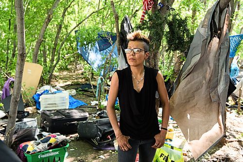 Mike Sudoma/Winnipeg Free Press
Cathy Smith takes a break from cleaning up the surroundings of her home inside an encampment along the Red River near Waterfront Drive Friday morning 
May 26, 2023