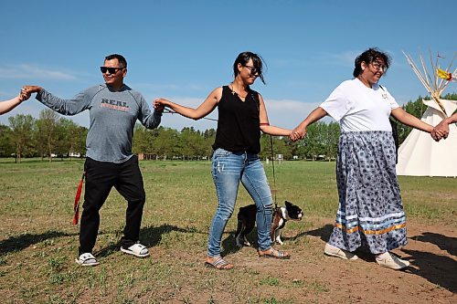 26052023
Cameron (L) and Charity West (C), who are walking across Canada to bring attention to Indigenous Men, Women and Children who have gone missing, take part in a round-dance celebrating the end of Indigenous Awareness Week events at CFB Shilo on Friday. Indigenous Awareness Week is an annual event celebrated nationally throughout the Canadian Armed Forces. 
(Tim Smith/The Brandon Sun)