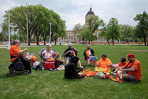 JESSICA LEE / WINNIPEG FREE PRESS

A dozen community members gathered at Memorial Park May 27, 2023, to remember the anniversary of the day in 2021 when 215 unmarked children’s graves were found in Canada.

Stand up