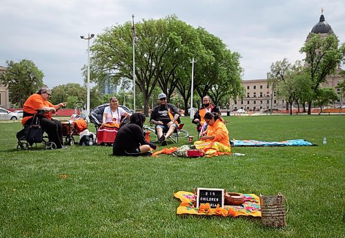 JESSICA LEE / WINNIPEG FREE PRESS

A dozen community members gathered at Memorial Park May 27, 2023, to remember the anniversary of the day in 2021 when 215 unmarked children&#x2019;s graves were found in Canada.

Stand up