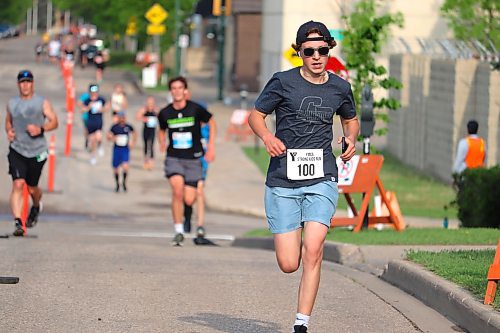 Hayden Foster gets ready to turn the corner on Lorne Avenue and reach the finish line of this year's YMCA Strong Kids Run in downtown Brandon. (Kyle Darbyson/The Brandon Sun) 