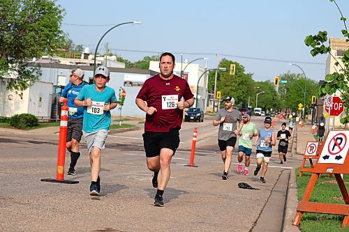 Michael and Rory Kelly near the end of the 5K portion of this year's YMCA Strong Kids Run on Sunday morning. (Kyle Darbyson/The Brandon Sun)