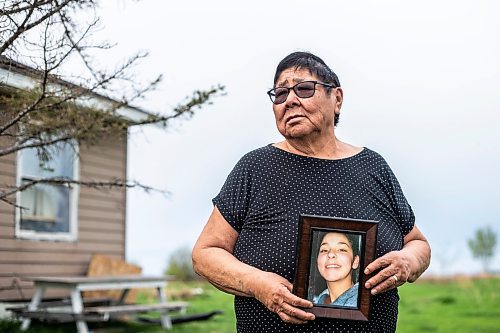 MIKAELA MACKENZIE / WINNIPEG FREE PRESS
 
 Janet Bruyere, grandmother of Fonassa Bruyere (whose body was discovered in a field northwest Winnipeg in 2007), poses for a portrait with a photo of Fonassa oustside of her home on Sagkeeng First Nation on Tuesday, May 23, 2023. For Shelley story.

Winnipeg Free Press 2023.