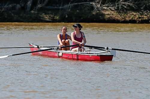 JOHN WOODS / WINNIPEG FREE PRESS
Rowing volunteer and high performance training program athlete Grace Harding, left, demonstrates as Tara Everett tries rowing for the first time at the national Come Try Rowing Day event at the Winnipeg Rowing Club Sunday, May 28, 2023. 

Re: standup