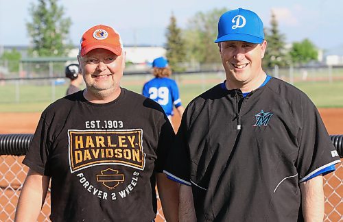 Longtime Brandon Minor Baseball Association president Blake Stephens, left, stepped down after last season and handed the reins to Scott Preston, who has had a successful transition into the role in the last few months. The pair are shown at a BMBA game that Preston was coaching on Monday evening at Simplot Millennium Park. (Perry Bergson/Brandon Sun)