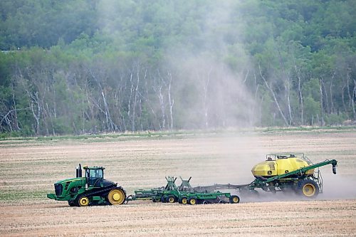 A farmer works a field west of Brandon on Monday afternoon. (Tim Smith/The Brandon Sun)