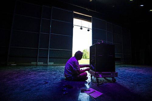 MIKAELA MACKENZIE / WINNIPEG FREE PRESS
 
Matthew Mulla, head of audio at Lyric Stage, builds a new PA system for the Performance Garden at The Leaf in the shade of the Lyric Stage at Assiniboine Park on Monday, May 29, 2023.  Standup.

Winnipeg Free Press 2023.