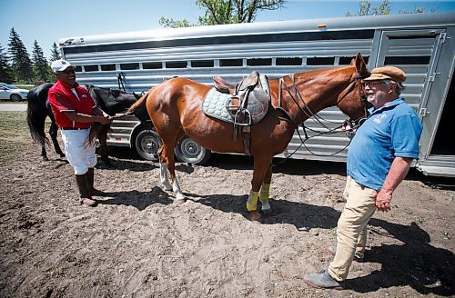 JOHN WOODS / WINNIPEG FREE PRESS
Canelo Rafael, a professional polo player from Mexico, left, and Gary Senft, who&#x2019;s been playing polo for 49 years, attend to Rafael&#x2019;s horse Cartel at Springfield Polo Club in Birds Hill Park, Sunday, May 28, 2023. 

Reporter: sanderson