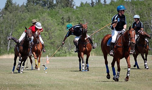 JOHN WOODS / WINNIPEG FREE PRESS
Garrett Smith, who works and plays polo in the family business/team Rocking S Polo, left and Isaias Palma Franco, from Mexico who works for Rocking S, play polo at Springfield Polo Club in Birds Hill Park, Sunday, May 28, 2023. 

Reporter: sanderson
