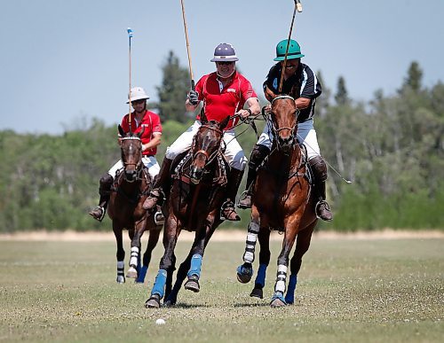 JOHN WOODS / WINNIPEG FREE PRESS
Bruce King, left, and Isaias Palma Franco, from Mexico who works for Rocking S, play polo at Springfield Polo Club in Birds Hill Park, Sunday, May 28, 2023. 

Reporter: sanderson