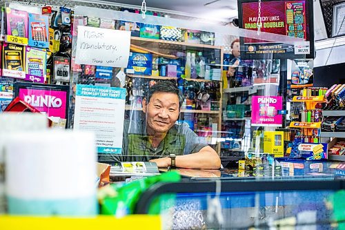 MIKAELA MACKENZIE / WINNIPEG FREE PRESS
 
Young Na, owner of V-Maxx Convenience Store, poses for a photo in his corner store on Friday, May 19, 2023. He's still planning on keeping his doors open. 