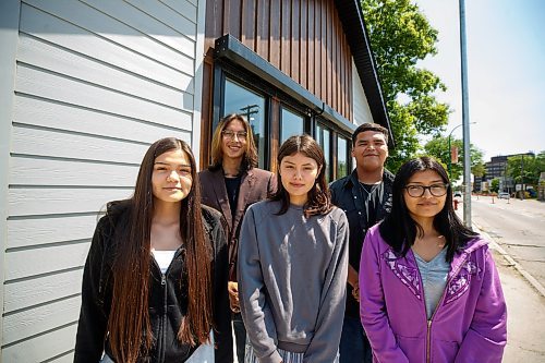 Mike Deal / Winnipeg Free Press
Students from left: Elissa Guimond, Logan Harvey, Erica Guimond, Orlando Harper, and Kirklynn Harper during the opening ceremony for Niiwin Minisiwiwag school, located at 383 Selkrik Avenue.
The Indigenous Education Caring Society is unveiling a new alternative school campus for First Nations, Metis and Inuit learners who've become disengaged with school in a bid to re-capture their attention, re-engage them and support them to graduate. The special North End site called, Niiwin Minisiwiwag, located at 383 Selkrik Avenue, is run via MOU/partnership with WSD, will support teens to complete their high school education. The aim is to find 'inactive students' (students that WSD receives funding for, but who have become lost in the system and don't currently attend classes). It's no secret COVID has worsened attendance in recent years. This project is a grassroots effort to make a dent in the issue of chronic absenteeism. The society is an initiative between Ma Mawi Wi Chitata Centre, Ndinawemaaganag Endawaad and the Community Education Development Association (CEDA). The newly-finished building was funded by a $500K grant from the Winnipeg Foundation, and grants from an anonymous donor and Sill Foundation, City of Winnipeg donated the land. We are getting an exclusive preview because of our ed coverage. 
See Maggie story
230530 - Tuesday, May 30, 2023.