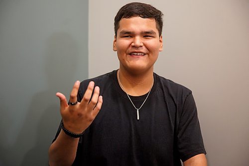 Mike Deal / Winnipeg Free Press
Orlando Harper, student and artist who helped design the school logo, during the opening ceremony for Niiwin Minisiwiwag school, located at 383 Selkrik Avenue.
The Indigenous Education Caring Society is unveiling a new alternative school campus for First Nations, Metis and Inuit learners who've become disengaged with school in a bid to re-capture their attention, re-engage them and support them to graduate. The special North End site called, Niiwin Minisiwiwag, located at 383 Selkrik Avenue, is run via MOU/partnership with WSD, will support teens to complete their high school education. The aim is to find 'inactive students' (students that WSD receives funding for, but who have become lost in the system and don't currently attend classes). It's no secret COVID has worsened attendance in recent years. This project is a grassroots effort to make a dent in the issue of chronic absenteeism. The society is an initiative between Ma Mawi Wi Chitata Centre, Ndinawemaaganag Endawaad and the Community Education Development Association (CEDA). The newly-finished building was funded by a $500K grant from the Winnipeg Foundation, and grants from an anonymous donor and Sill Foundation, City of Winnipeg donated the land. We are getting an exclusive preview because of our ed coverage. 
See Maggie story
230530 - Tuesday, May 30, 2023.