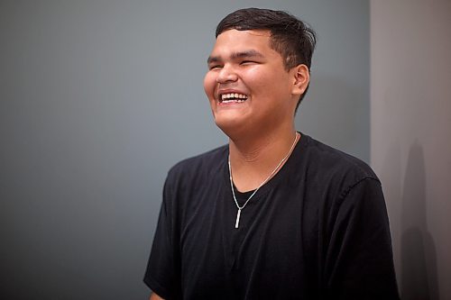 Mike Deal / Winnipeg Free Press
Orlando Harper, student and artist who helped design the school logo, during the opening ceremony for Niiwin Minisiwiwag school, located at 383 Selkrik Avenue.
The Indigenous Education Caring Society is unveiling a new alternative school campus for First Nations, Metis and Inuit learners who've become disengaged with school in a bid to re-capture their attention, re-engage them and support them to graduate. The special North End site called, Niiwin Minisiwiwag, located at 383 Selkrik Avenue, is run via MOU/partnership with WSD, will support teens to complete their high school education. The aim is to find 'inactive students' (students that WSD receives funding for, but who have become lost in the system and don't currently attend classes). It's no secret COVID has worsened attendance in recent years. This project is a grassroots effort to make a dent in the issue of chronic absenteeism. The society is an initiative between Ma Mawi Wi Chitata Centre, Ndinawemaaganag Endawaad and the Community Education Development Association (CEDA). The newly-finished building was funded by a $500K grant from the Winnipeg Foundation, and grants from an anonymous donor and Sill Foundation, City of Winnipeg donated the land. We are getting an exclusive preview because of our ed coverage. 
See Maggie story
230530 - Tuesday, May 30, 2023.