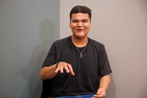 Mike Deal / Winnipeg Free Press
Orlando Harper, student and artist who helped design the school logo, during the opening ceremony for Niiwin Minisiwiwag school, located at 383 Selkrik Avenue.
The Indigenous Education Caring Society is unveiling a new alternative school campus for First Nations, Metis and Inuit learners who've become disengaged with school in a bid to re-capture their attention, re-engage them and support them to graduate. The special North End site called, Niiwin Minisiwiwag, located at 383 Selkrik Avenue, is run via MOU/partnership with WSD, will support teens to complete their high school education. The aim is to find 'inactive students' (students that WSD receives funding for, but who have become lost in the system and don't currently attend classes). It's no secret COVID has worsened attendance in recent years. This project is a grassroots effort to make a dent in the issue of chronic absenteeism. The society is an initiative between Ma Mawi Wi Chitata Centre, Ndinawemaaganag Endawaad and the Community Education Development Association (CEDA). The newly-finished building was funded by a $500K grant from the Winnipeg Foundation, and grants from an anonymous donor and Sill Foundation, City of Winnipeg donated the land. We are getting an exclusive preview because of our ed coverage. 
See Maggie story
230530 - Tuesday, May 30, 2023.