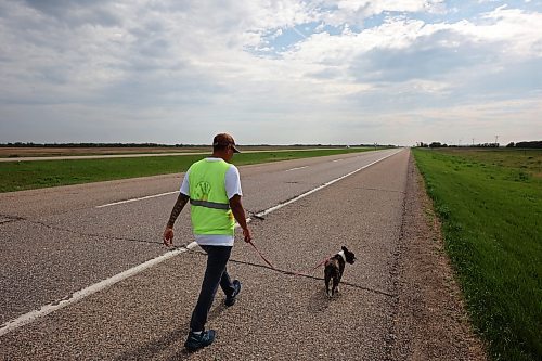 Cameron West walks east along the Trans Canada Highway towards Carberry with his french bulldog Gretchen while his wife Charity takes her turn driving the support vehicle on Monday morning. The couple are walking across Canada to draw attention to missing and murdered Indigenous people. They began their first leg of the walk in Siksika Nation in southern Alberta and are walking to St. John's, Nfld. From there they will begin their second leg in Prince Rupert , BC, and walk the Highway of Tears, Highway 16, where several Indigenous Canadians have gone missing, home to Prince George. They average approximately 40-50 KM's a day. 
(Tim Smith/The Brandon Sun)