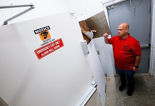 JOHN WOODS / WINNIPEG FREE PRESS
Rafael Palao, owner of Adam &amp; Eve, is photographed Monday, May 30, 2023 beside damage that was caused when his store was broken into two weeks ago. 

Reporter: piche