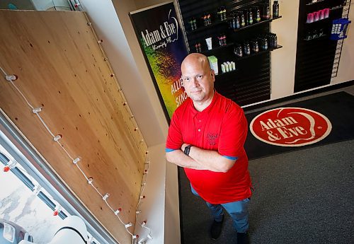 JOHN WOODS / WINNIPEG FREE PRESS
Rafael Palao, owner of Adam &amp; Eve, is photographed Monday, May 30, 2023 beside damage that was caused when his store was broken into two weeks ago. 

Reporter: piche