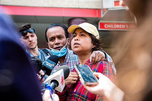 MIKAELA MACKENZIE / WINNIPEG FREE PRESS

Parents Niranjan (left) and Archana Paul speak to the media outside of HSC Children&#x573; Hospital, where injured St. John&#x573;-Ravencourt students were taken after a bridge collapsed during a field trip at Fort Gibraltar, on Wednesday, May 31, 2023. For Maggie/Chris/Erik story.
Winnipeg Free Press 2023