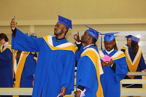 Daniel Anerobi snaps a selfie with some of his fellow Brandon University Faculty of Science graduates right before Thursday's morning convocation ceremony at the Healthy Living Centre is scheduled to begin. (Kyle Darbyson/The Brandon Sun)