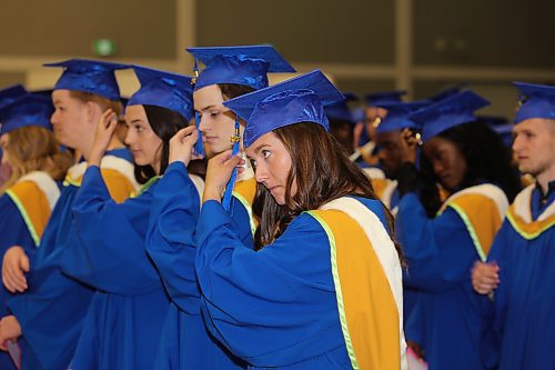 Brandon University science graduates collectively move the tassels on their caps from the right to the left after receiving their diplomas during Thursday morning's convocation ceremony at the Healthy Living Centre. (Kyle Darbyson/The Brandon Sun)