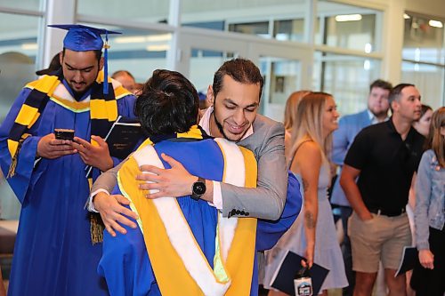 Brandon University graduates meet up with friends and family at the Healthy Living Centre lobby after Thursday morning's convocation ceremony comes to a close. (Kyle Darbyson/The Brandon Sun)