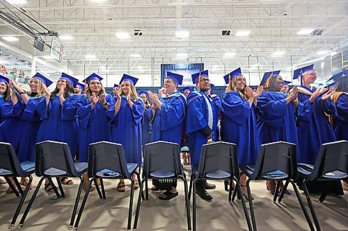 Brandon University Faculty of Education graduates take a moment to applaud their parents and families during the Thursday afternoon convocation ceremony at the Healthy Living Centre. (Matt Goerzen/The Brandon Sun)